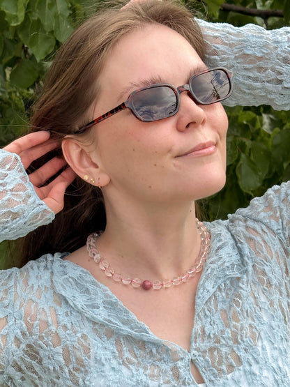 Woman wearing sunglasses with a blurred background