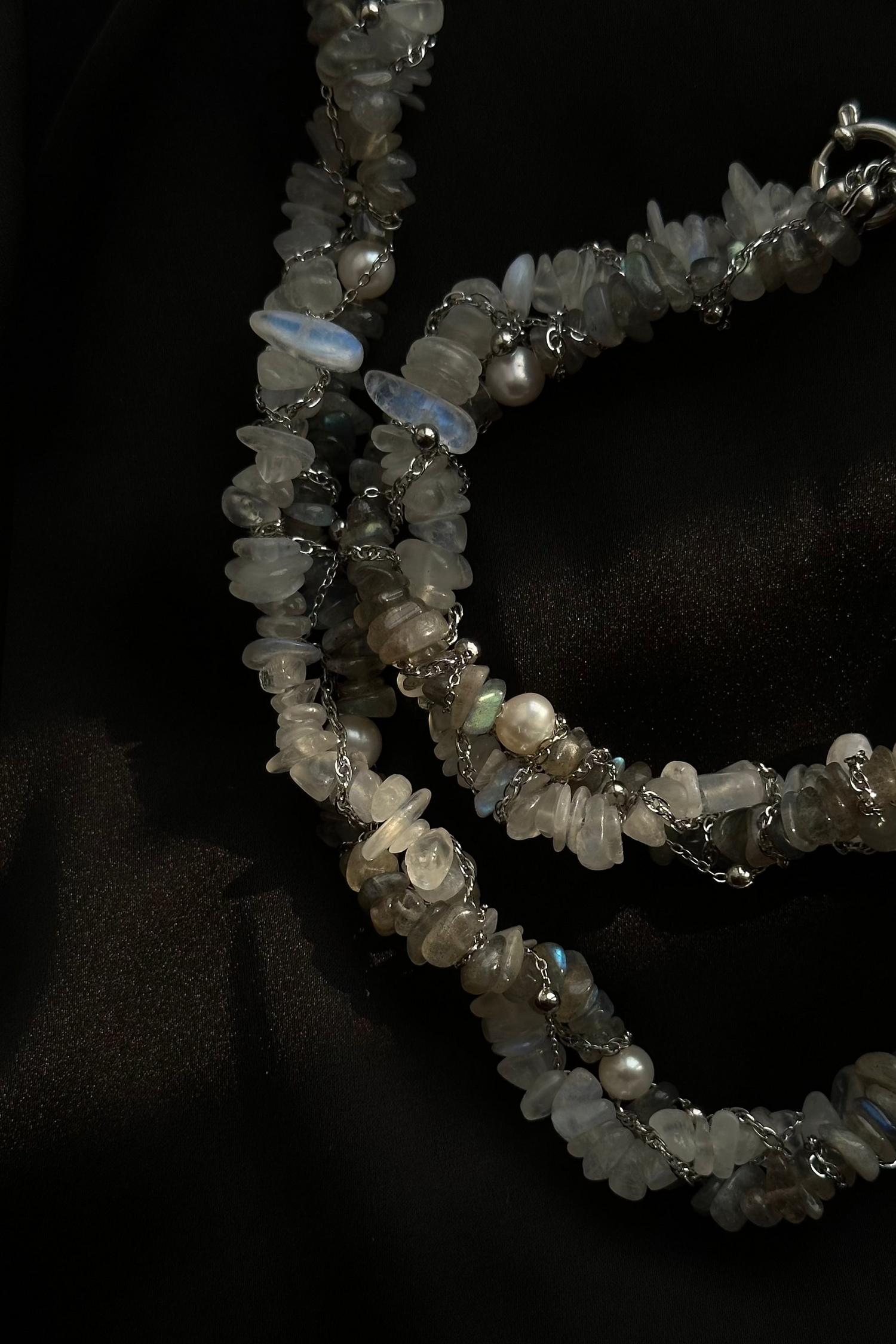 Necklace with stone beads on a black background